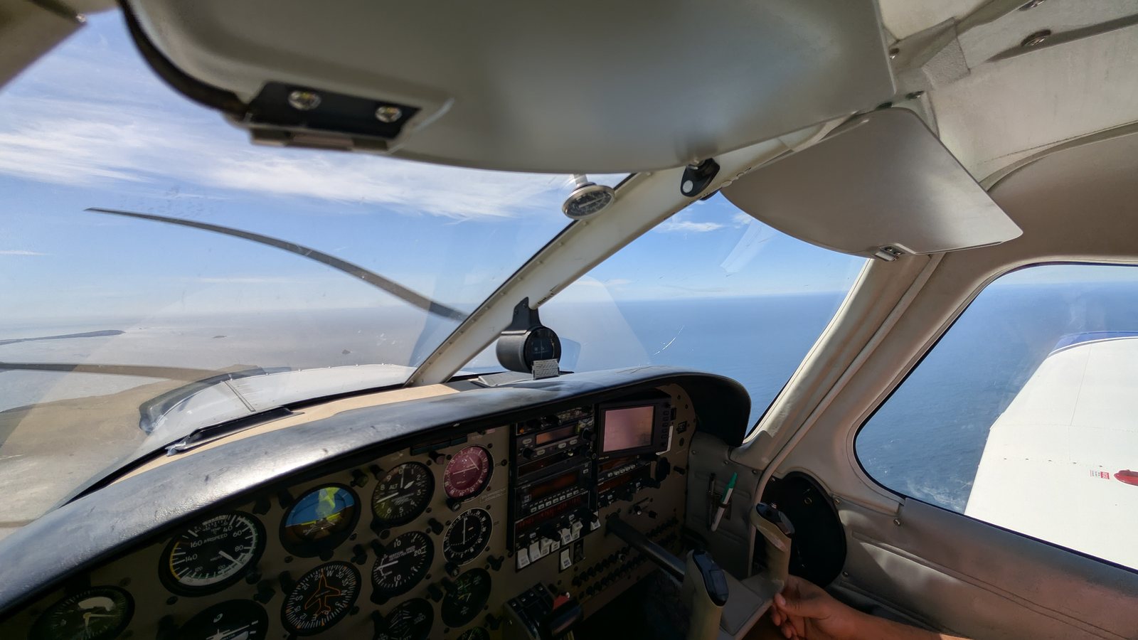 Pilot's-eye view over the Sussex coast from the cockpit of an Adur Aviation aircraft